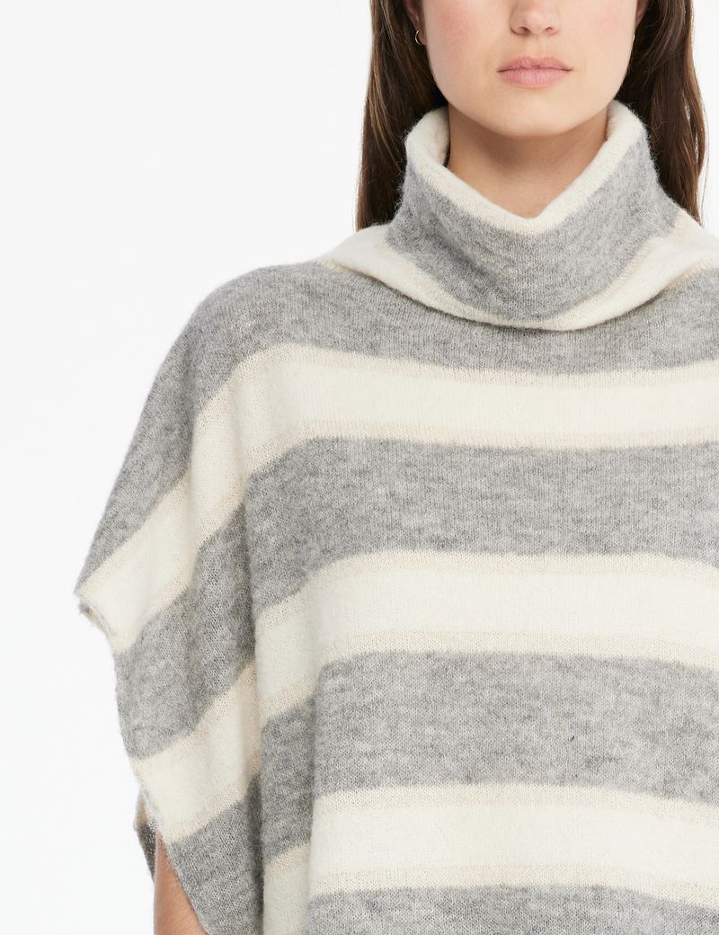 White 2024 poncho sweater